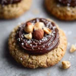 Plate of hazelnut cookies with dark chocolate ganache topping