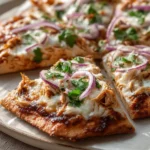 Delicious BBQ chicken flatbread topped with fresh ingredients for a quick dinner.